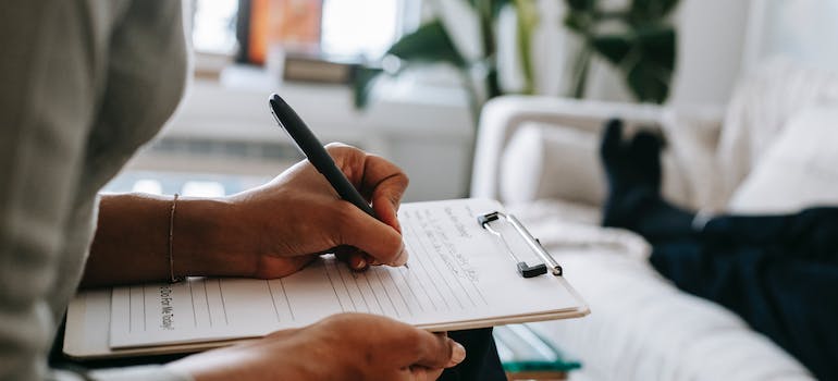 A psychologist writing notes.