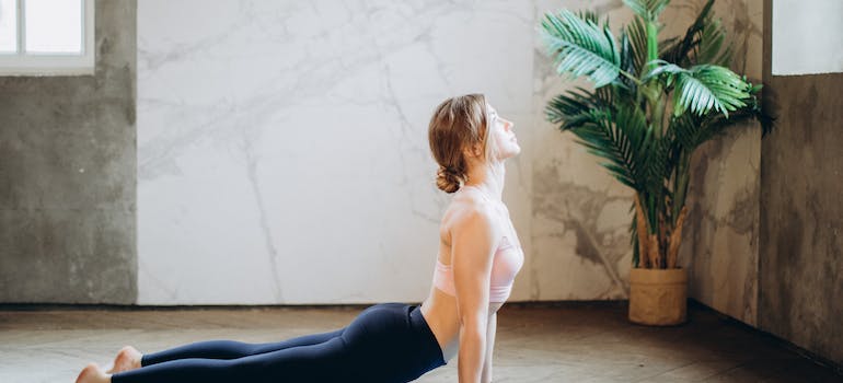 A woman practicing yoga therapy for addiction recovery.