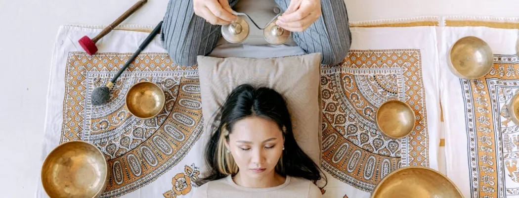 Woman experiencing sound therapy as a part of yoga and sound therapy