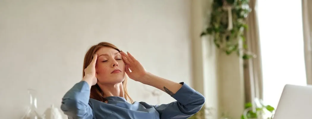 A person experiencing a headache during medical detox