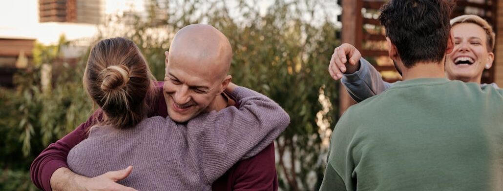 Family members hugging one another