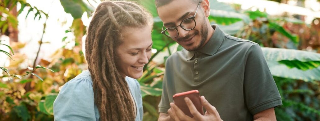 Two people looking for a benzo detox Florida center using a smartphone