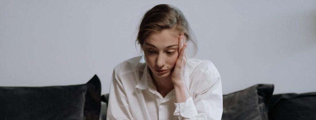 A person experiencing sinus issues during a heroin detox Florida program