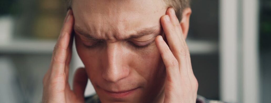 A person experiencing a headache